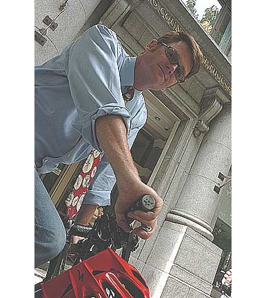 Seatle bicycle lawyer Bob Anderton commuting by bike to the King County Courthouse where he is pictured.